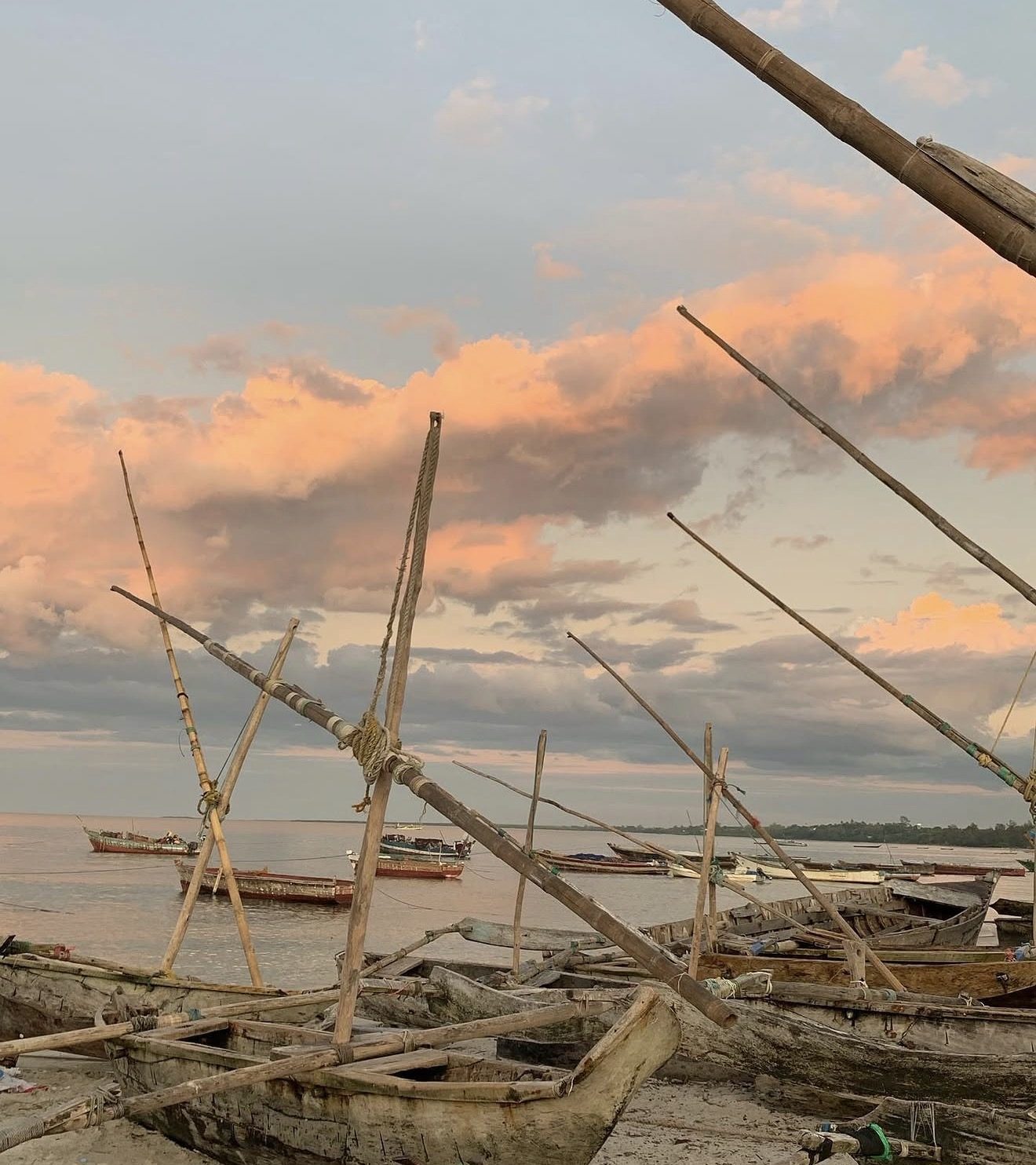 Traditional dhows on the beach in Bagamoyo at sunset